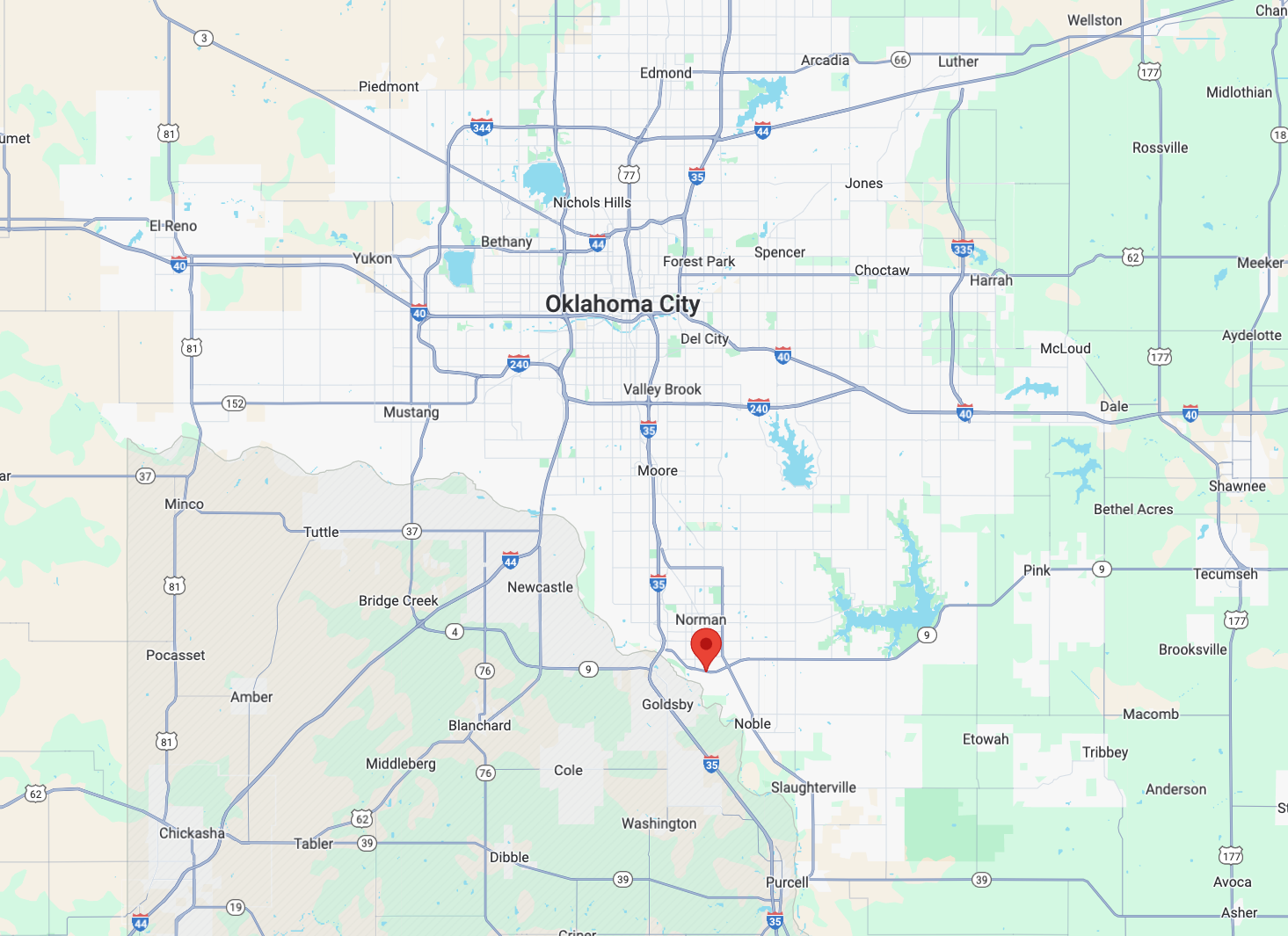 map of central Oklahoma with a red pin along Hwy 9 in Norman, OK