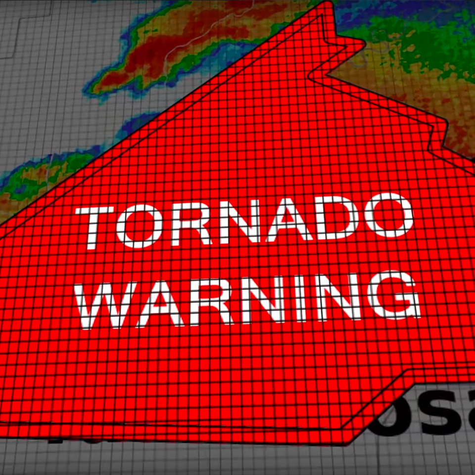 radar display with red polygon overlay with text that says 'tornado warning'