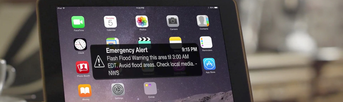 Flash flood alert on tablet screen
