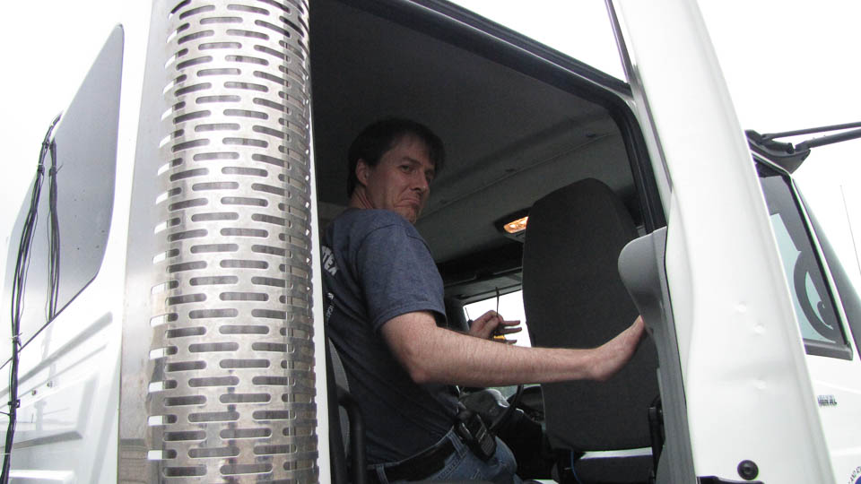 Researcher in the cab of a mobile radar truck.